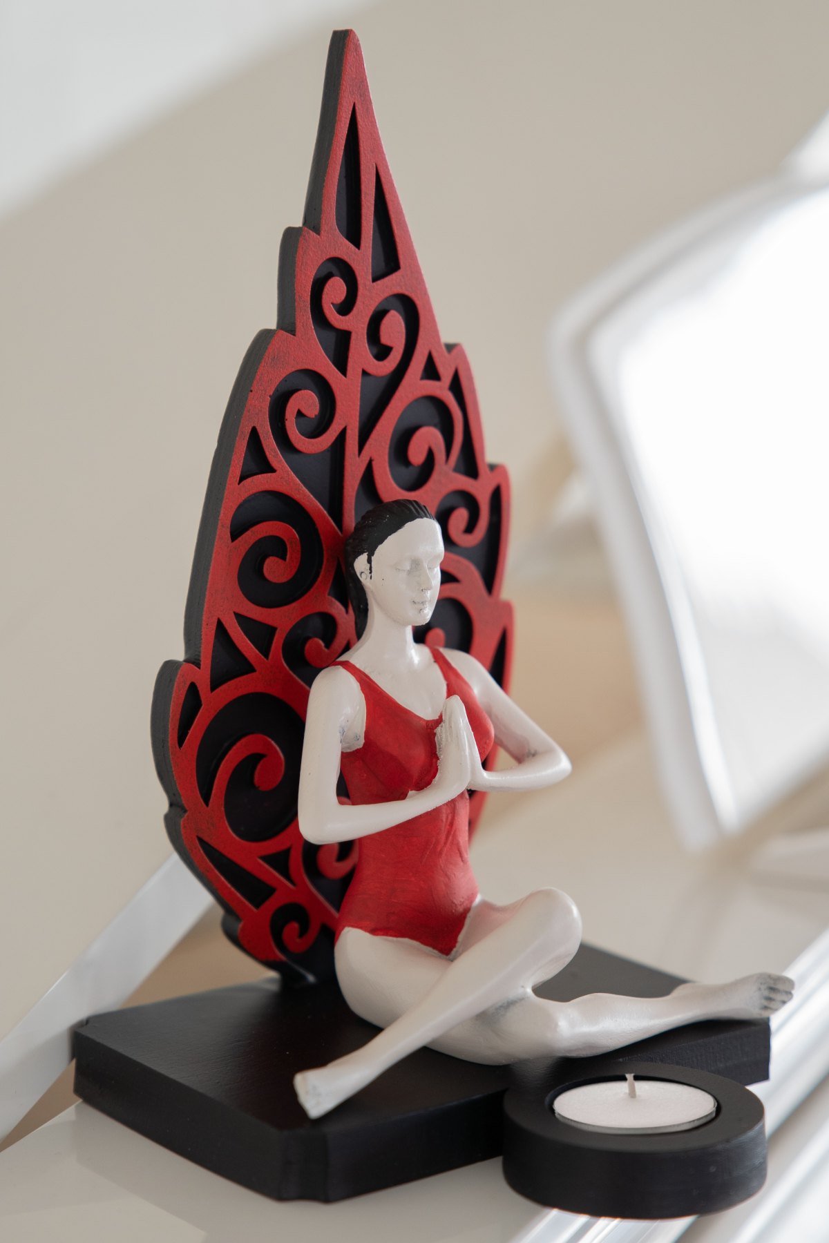 Decorative red leaf yoga figurine